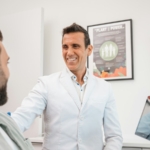 Friendly dentist in Muncie, Indiana welcoming a new patient