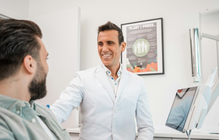 Friendly dentist in Muncie, Indiana welcoming a new patient