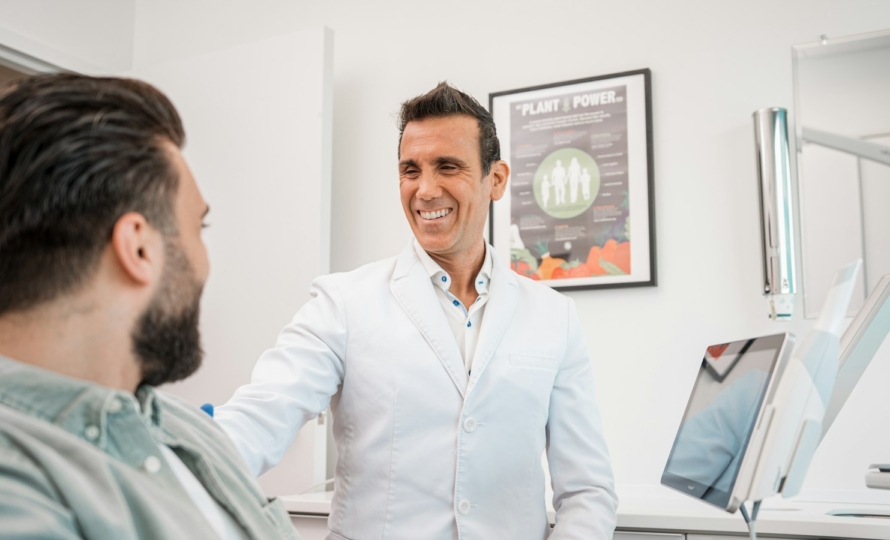 Friendly dentist in Muncie, Indiana welcoming a new patient